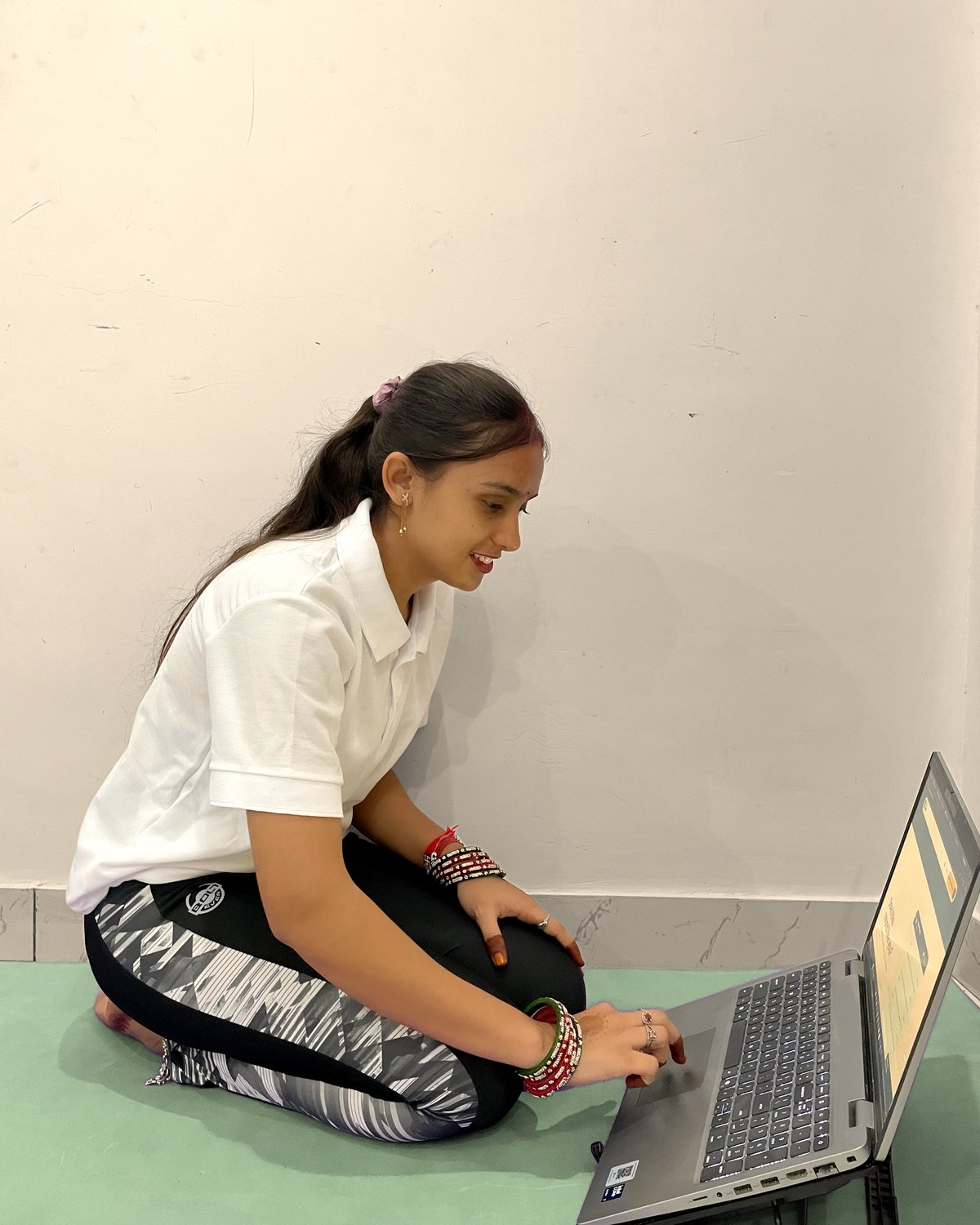 Latika teaching a live class to her laptop camera